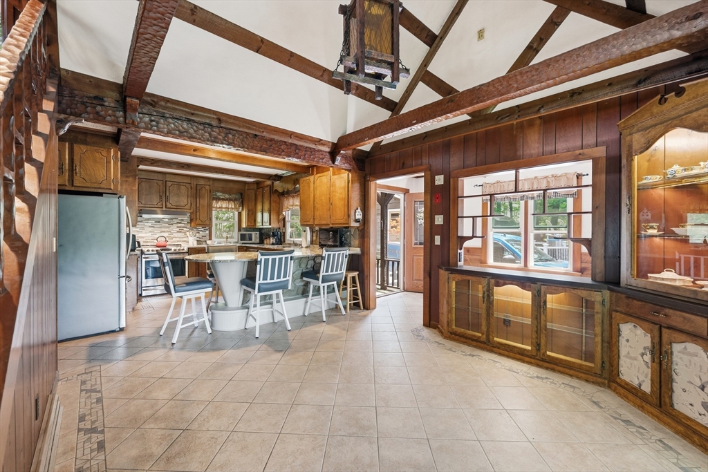 43 Flint Road Tyngsborough, MA 01879 - Photo 6 of 40 a view of a dining room with furniture window and outside view