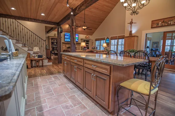 a spacious bathroom with a granite countertop sink a mirror and a