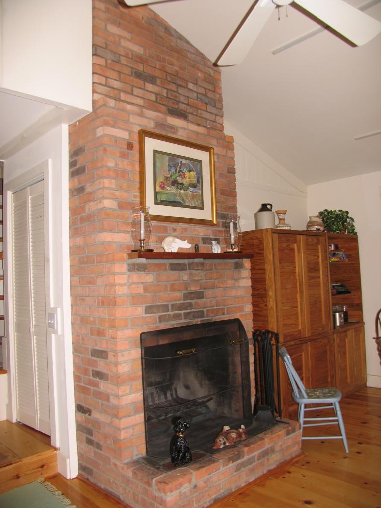 105 Lake Road Richmond, MA 01201 - Photo 4 of 8 a view of a livingroom with a fireplace and furniture