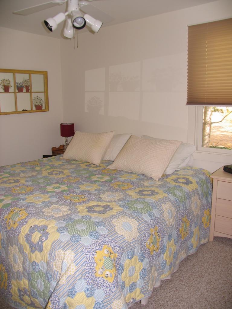 105 Lake Road Richmond, MA 01201 - Photo 6 of 8 a bedroom with a bed and a window