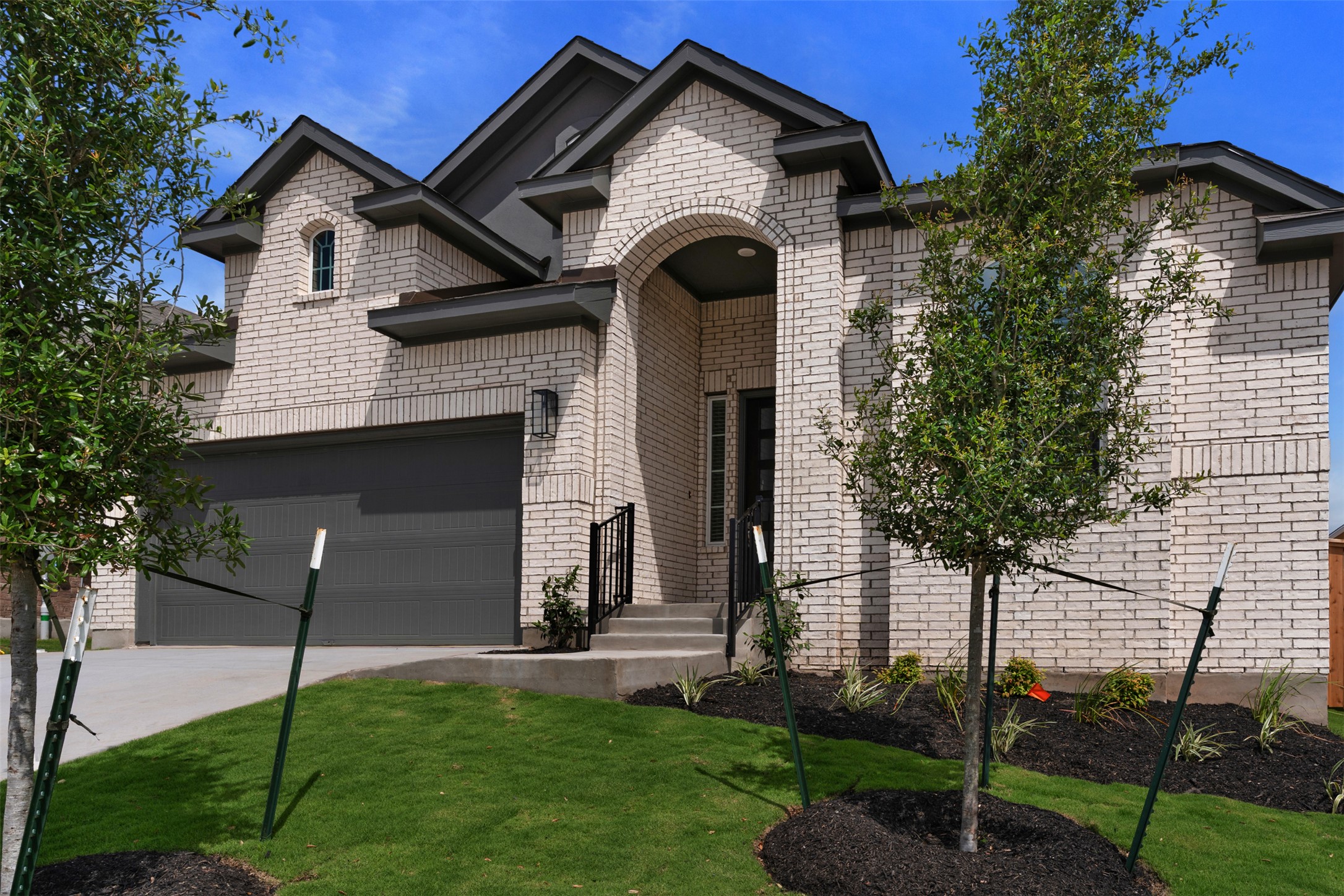 1129 Pansy Trail Georgetown, TX 78628 - Photo 2 of 29 Brick exterior with contrasting dark gray trim and roof