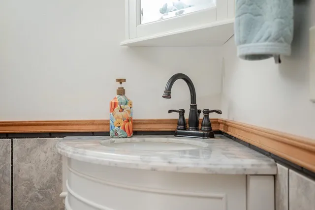 a kitchen with a refrigerator a sink and cabinets