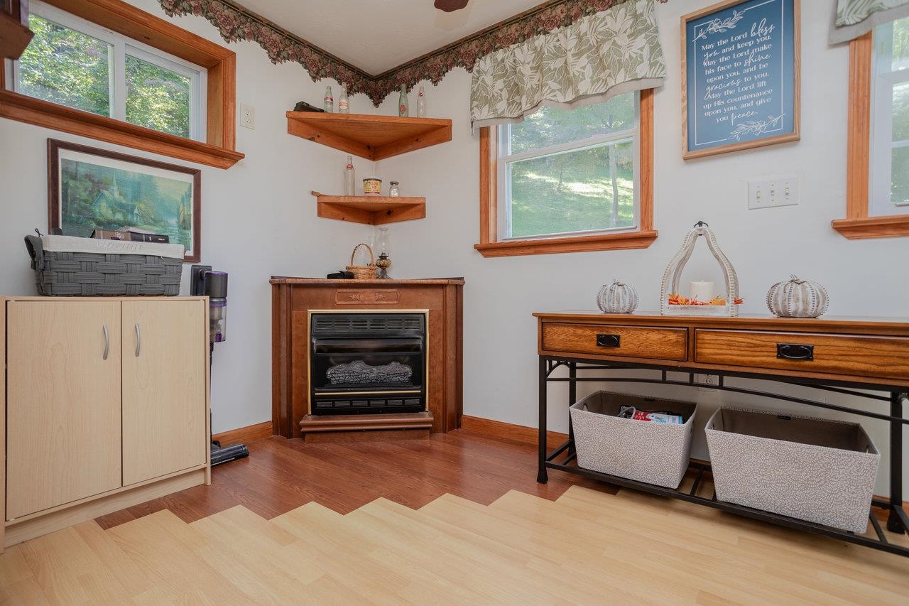 279 Helms Road Stanley, VA 22851 - Photo 26 of 64 a room with fireplace a stove and a window