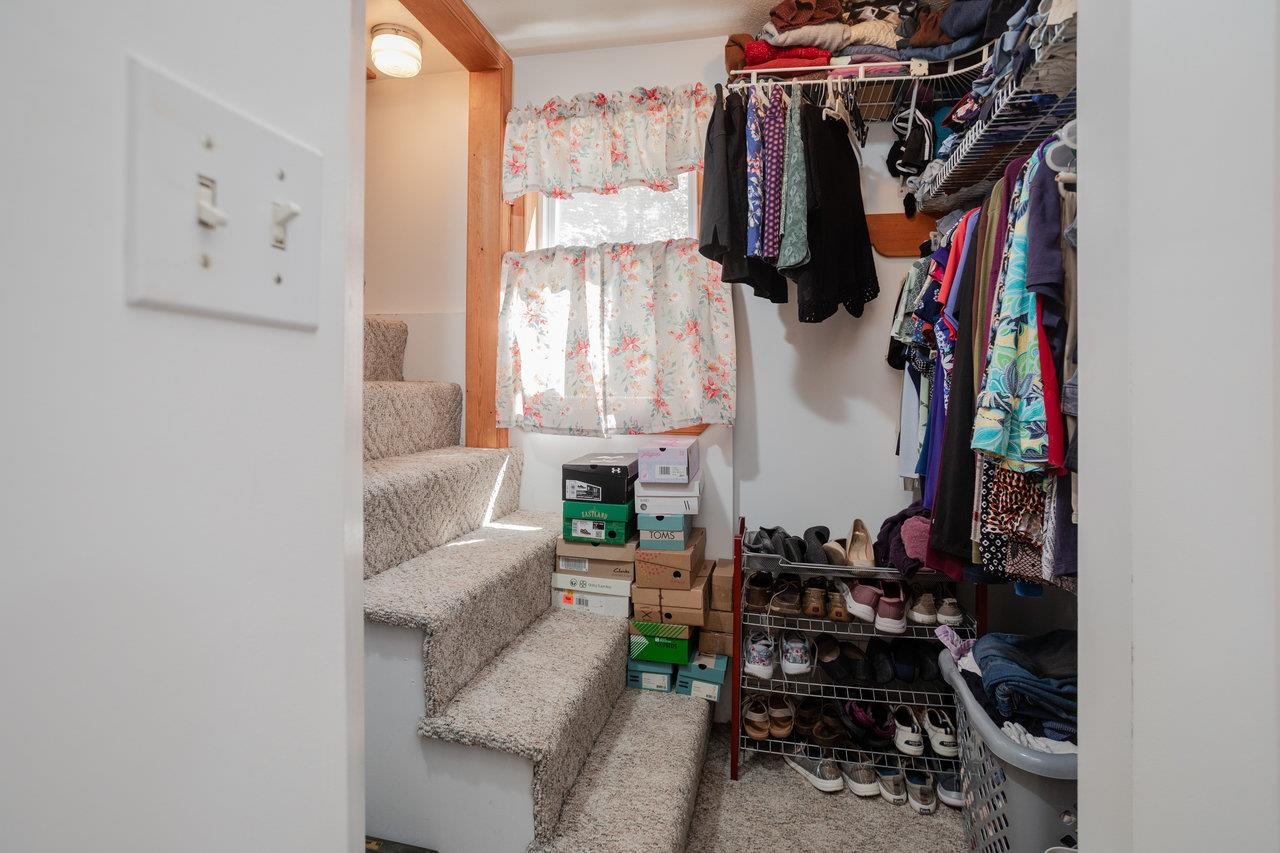 279 Helms Road Stanley, VA 22851 - Photo 35 of 64 a view of walk in closet with clothes and shoes