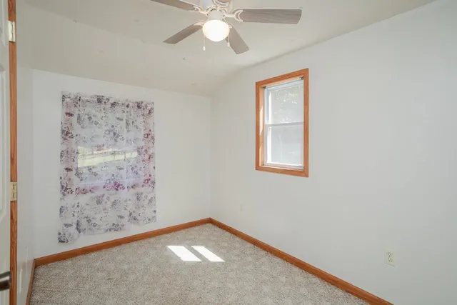 a view of a barn in the backyard of house