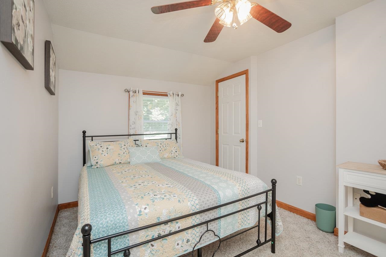 279 Helms Road Stanley, VA 22851 - Photo 39 of 64 a bedroom with a bed and a dresser