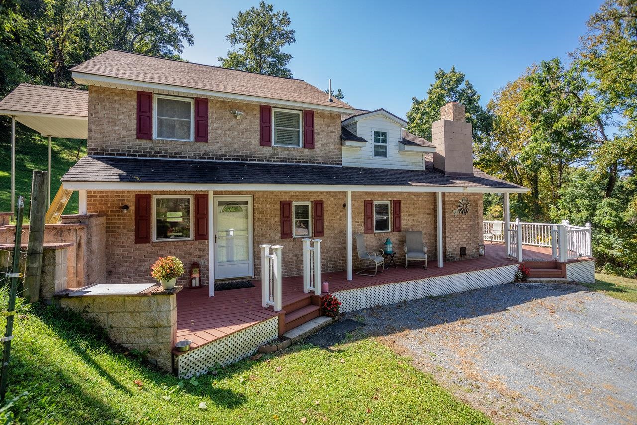 279 Helms Road Stanley, VA 22851 - Photo 43 of 64 a front view of a house with patio