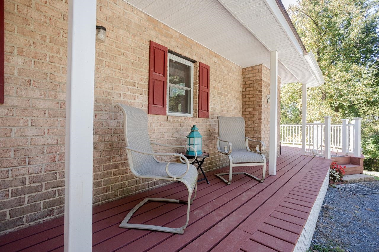 279 Helms Road Stanley, VA 22851 - Photo 45 of 64 a balcony with wooden floor and furniture