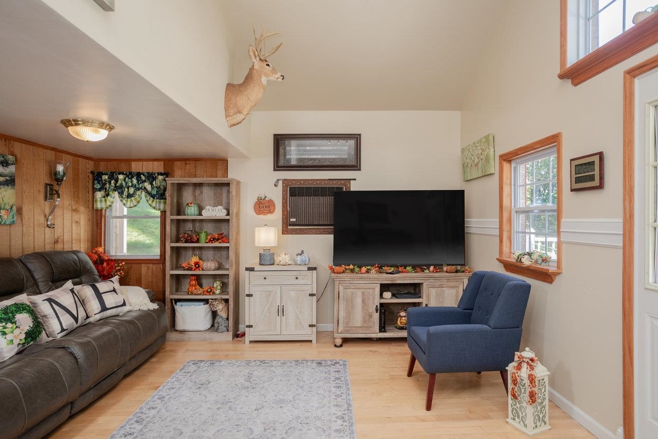 279 Helms Road Stanley, VA 22851 - Photo 5 of 64 a living room with furniture and a flat screen tv