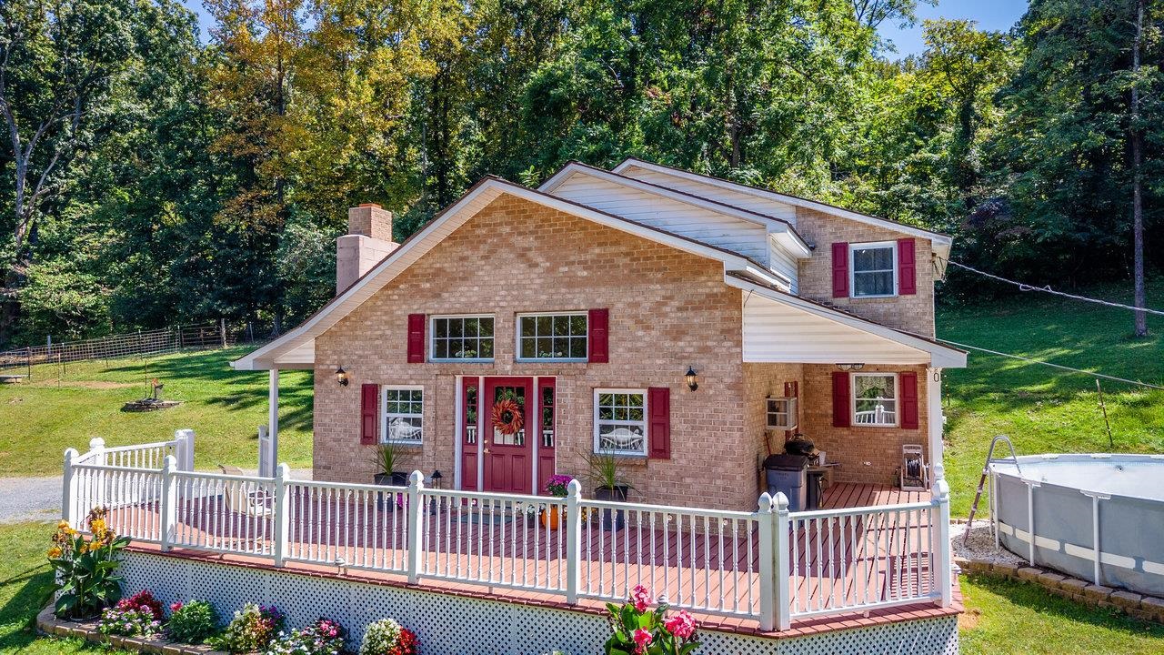 279 Helms Road Stanley, VA 22851 - Photo 60 of 64 front view of a house with a yard