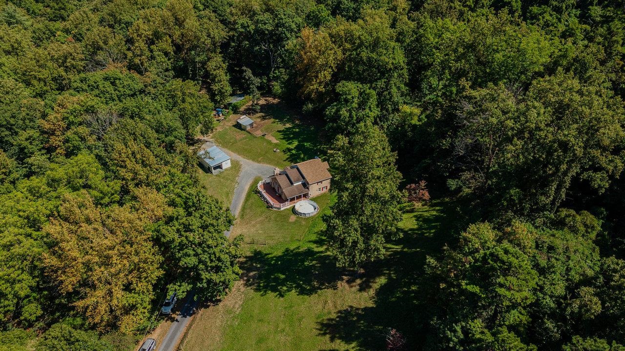 279 Helms Road Stanley, VA 22851 - Photo 62 of 64 a aerial view of a house with a yard and outdoor seating
