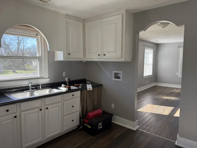 a kitchen with a sink and cabinets