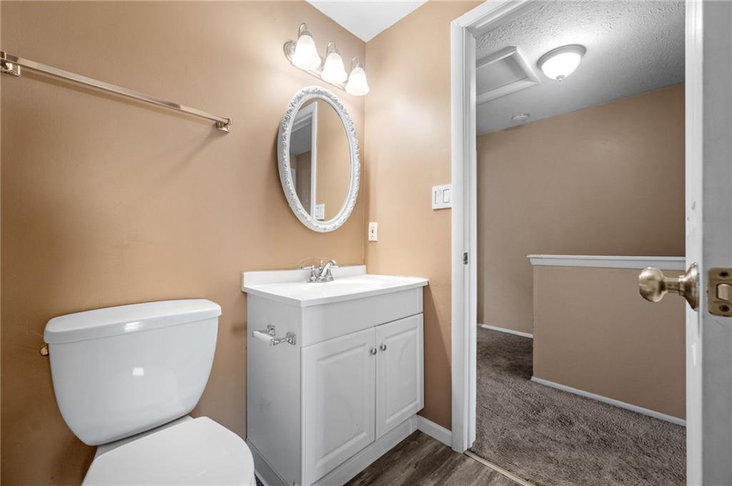 282 Quail Run Road Venetia, PA 15367 - Photo 16 of 28 a bathroom with a toilet sink and a mirror