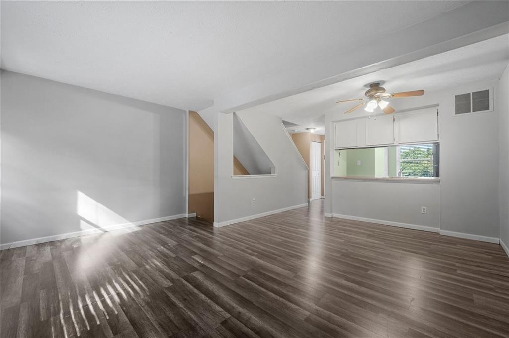 282 Quail Run Road Venetia, PA 15367 - Photo 3 of 28 a view of empty room with wooden floor and fan