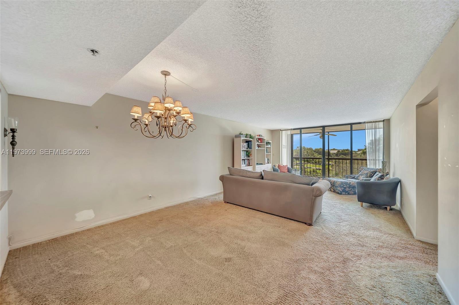 6620 Boca Del Mar Drive, Unit 502 Boca Raton, FL 33433 - Photo 17 of 52 Dining room area with chandelier