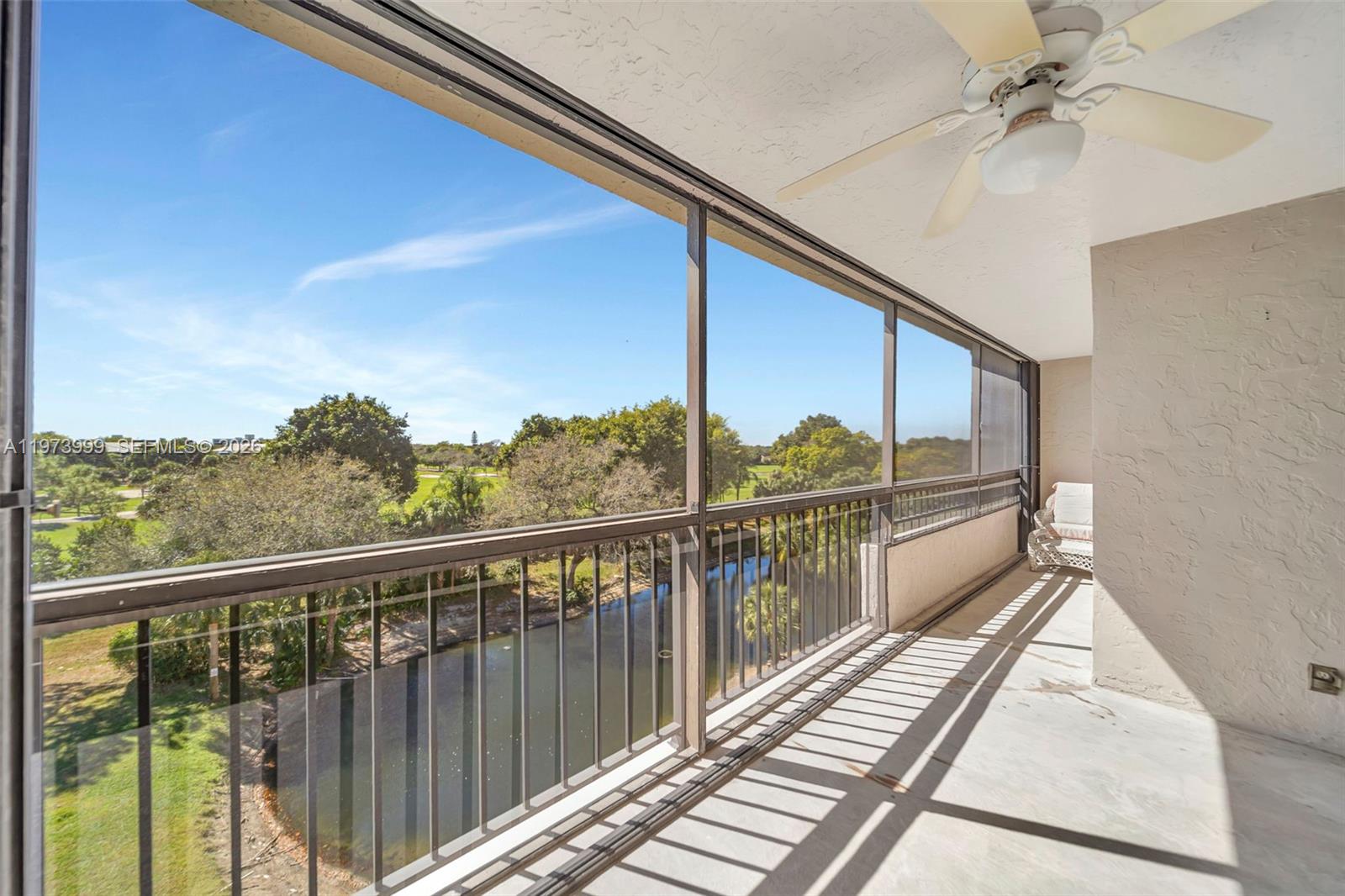 6620 Boca Del Mar Drive, Unit 502 Boca Raton, FL 33433 - Photo 27 of 52 Balcony runs the full length of the condo - Accordion Hurricane shutters