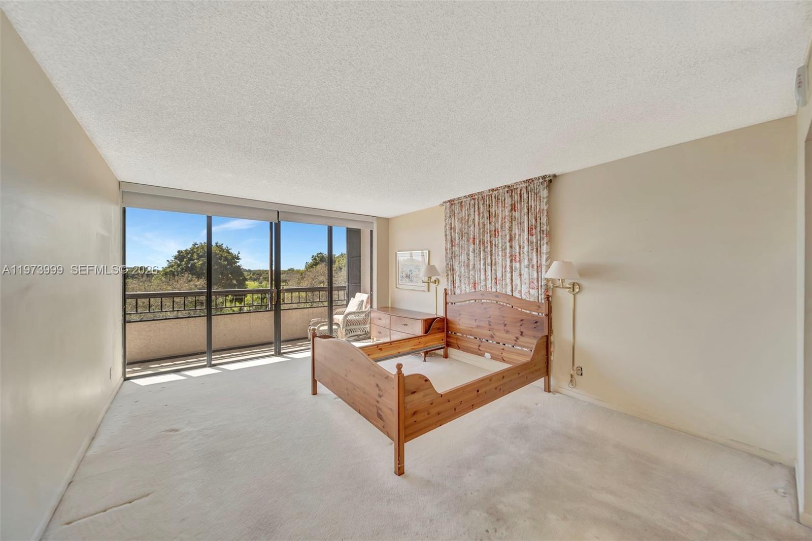 6620 Boca Del Mar Drive, Unit 502 Boca Raton, FL 33433 - Photo 29 of 52 Large Primary Bedroom with floor to ceiling sliders and access to screened balcony