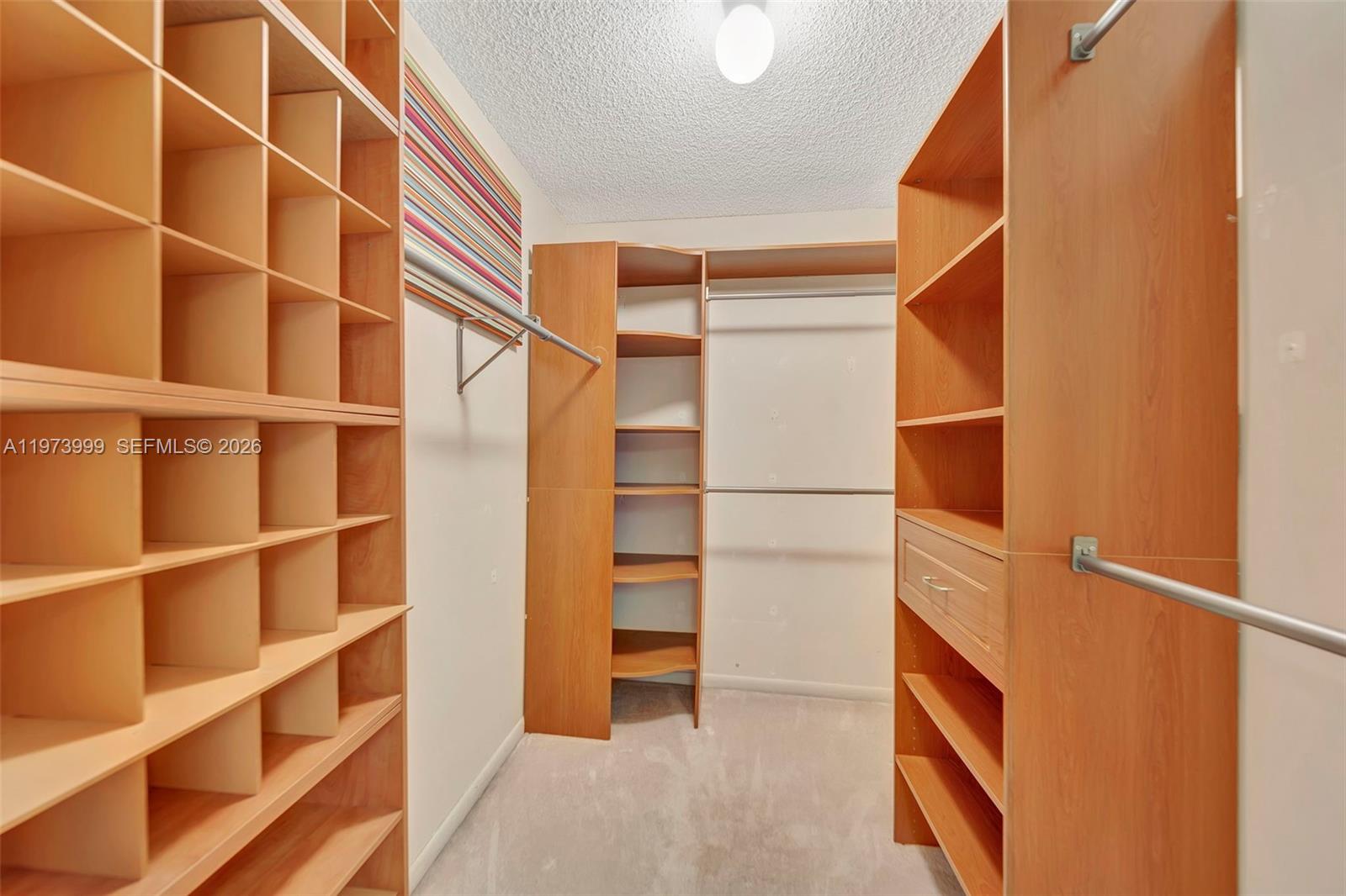 6620 Boca Del Mar Drive, Unit 502 Boca Raton, FL 33433 - Photo 36 of 52 Custom closet installation in large walk-in closet in Primary BR area
