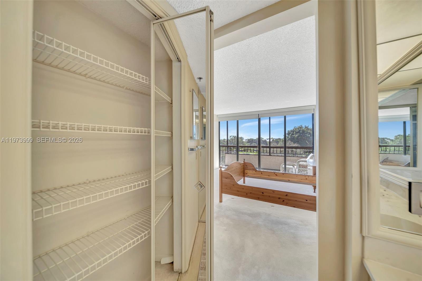 6620 Boca Del Mar Drive, Unit 502 Boca Raton, FL 33433 - Photo 37 of 52 Linen closet in primary bathroom