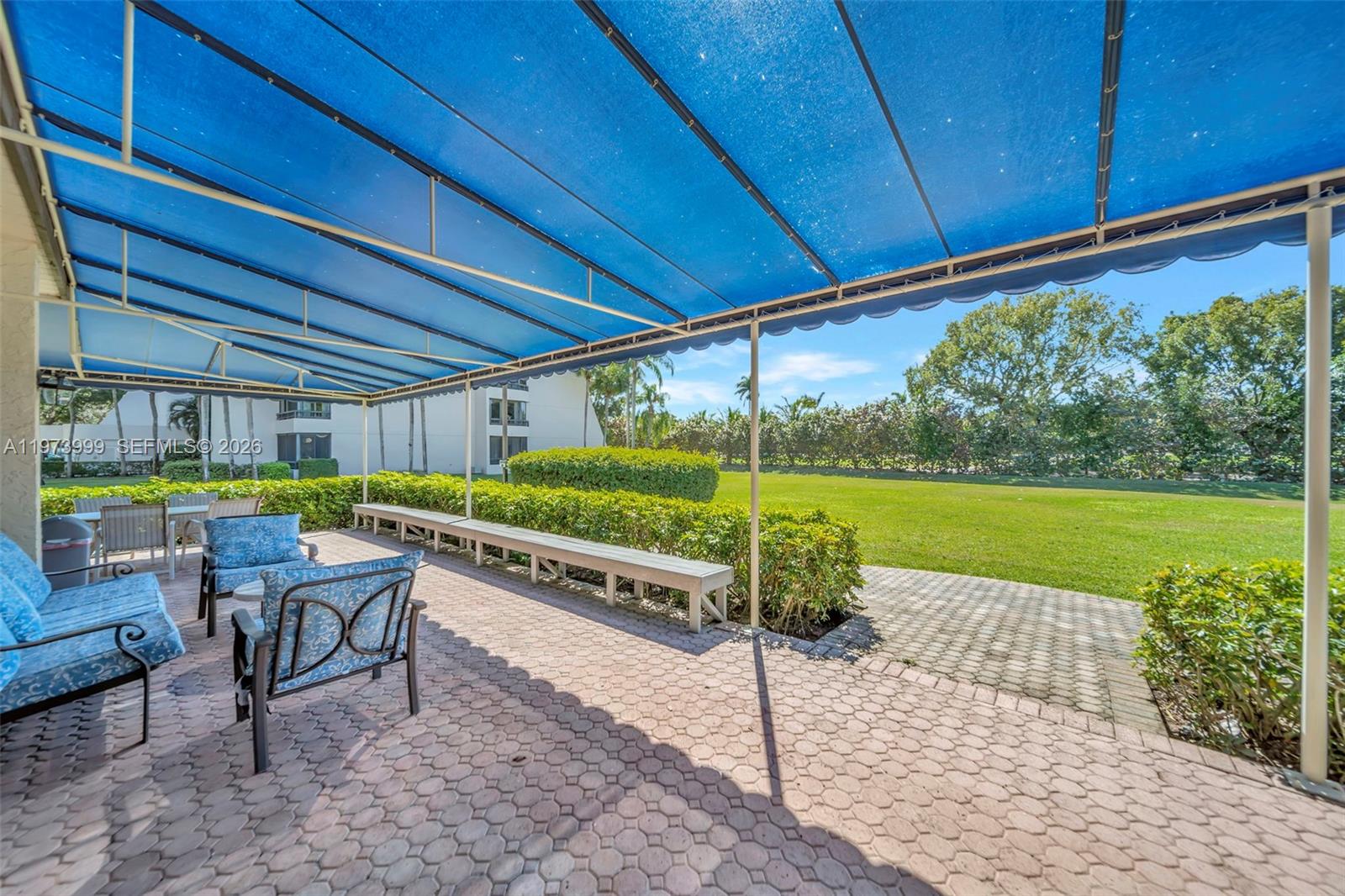 6620 Boca Del Mar Drive, Unit 502 Boca Raton, FL 33433 - Photo 46 of 52 Covered community patio area with seating