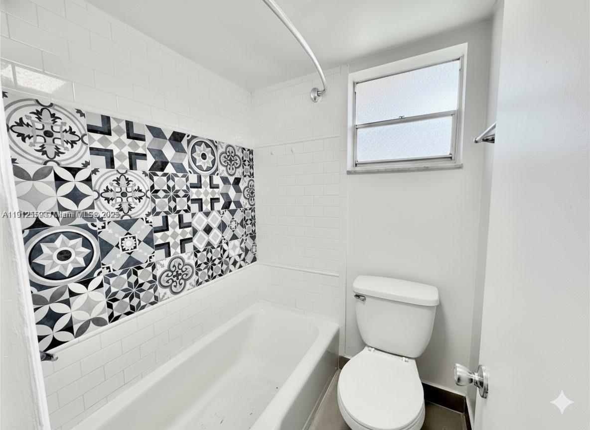 14901 Southwest 4th Street, Unit 5A Pembroke Pines, FL 33027 - Photo 11 of 21 a bathroom with a toilet and a bathtub