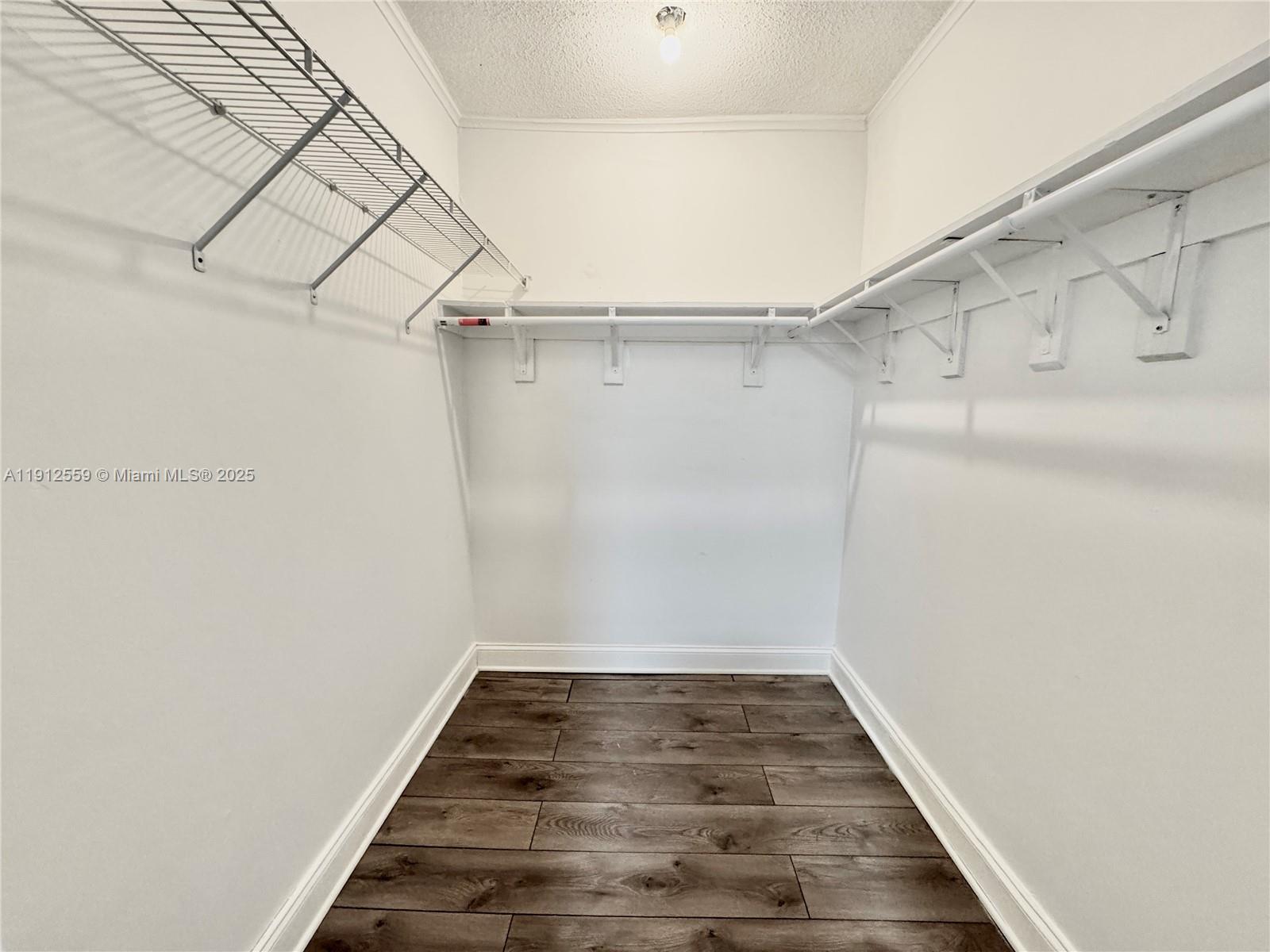 14901 Southwest 4th Street, Unit 5A Pembroke Pines, FL 33027 - Photo 13 of 21 a view of a room with racks on the wall