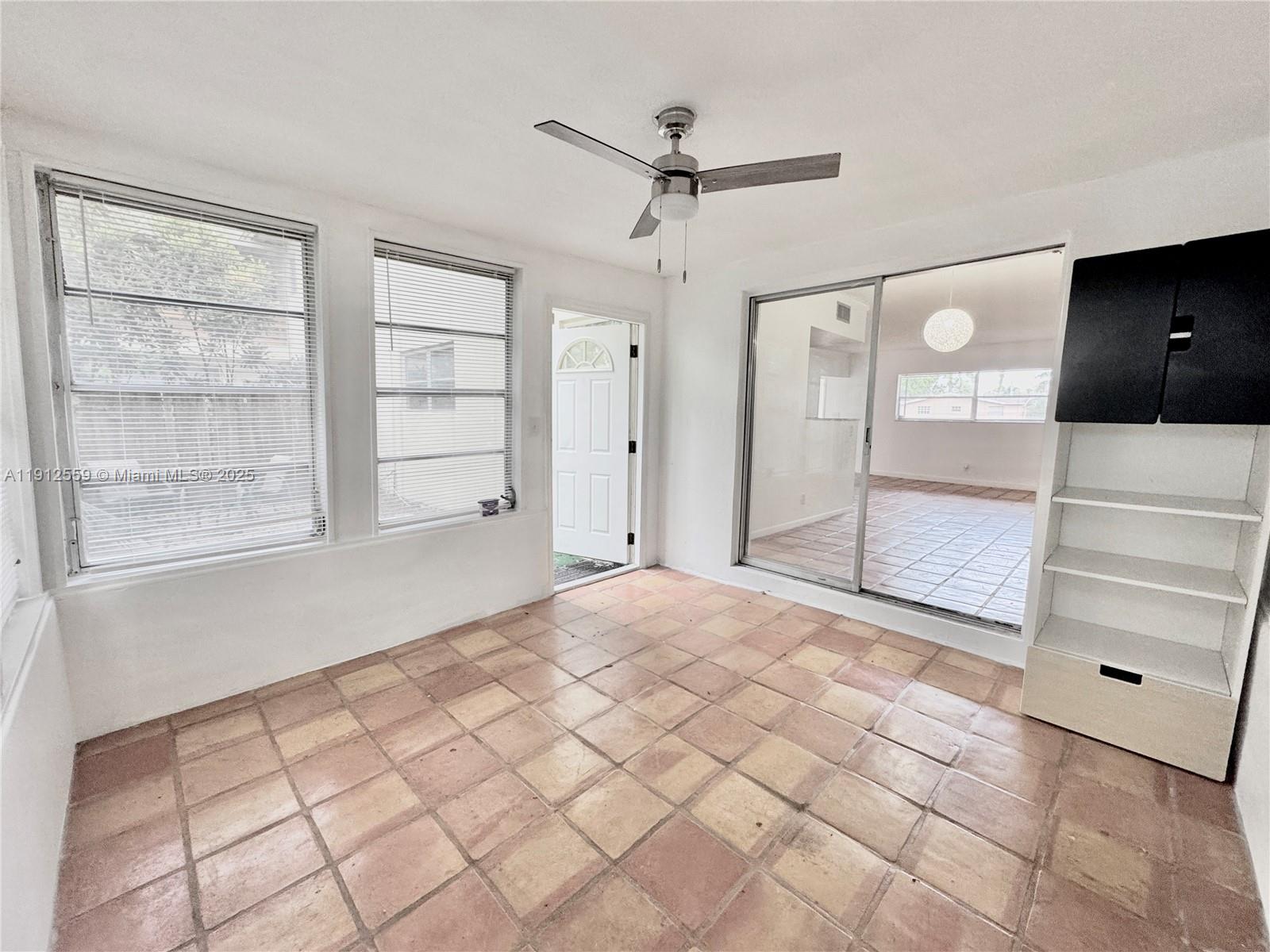 14901 Southwest 4th Street, Unit 5A Pembroke Pines, FL 33027 - Photo 15 of 21 a view of empty room with a window and ceiling fan