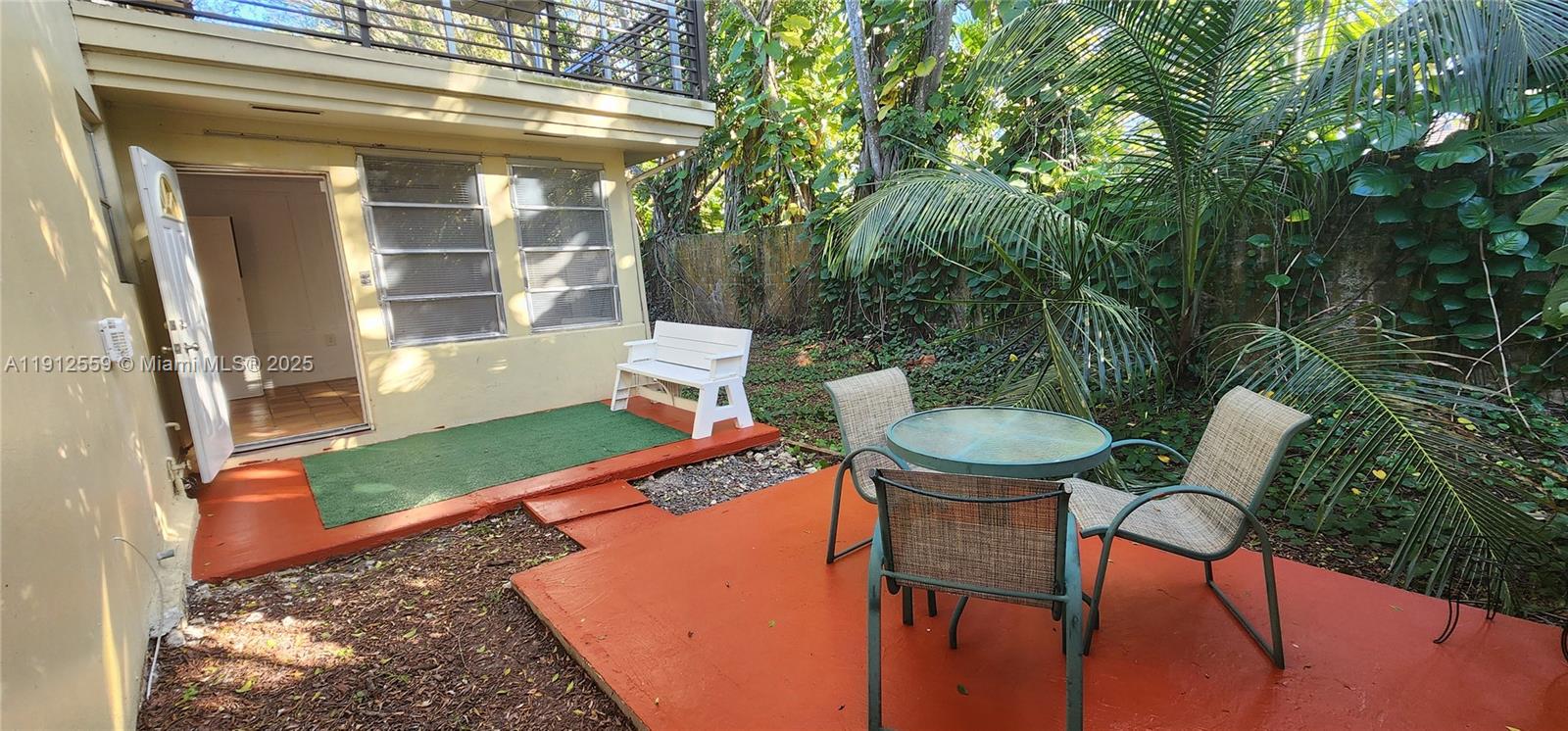 14901 Southwest 4th Street, Unit 5A Pembroke Pines, FL 33027 - Photo 18 of 21 a view of a chair and table in the patio