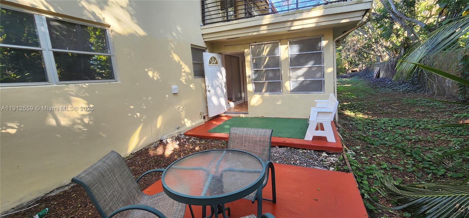 14901 Southwest 4th Street, Unit 5A Pembroke Pines, FL 33027 - Photo 19 of 21 a backyard of a house with outdoor seating