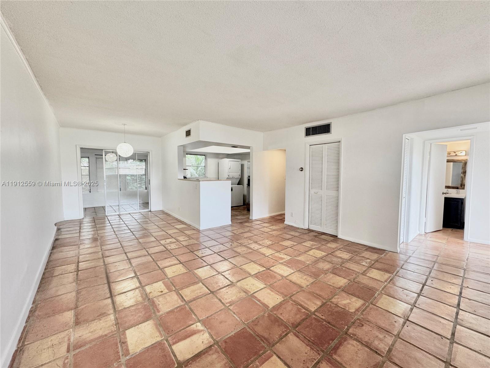 14901 Southwest 4th Street, Unit 5A Pembroke Pines, FL 33027 - Photo 5 of 21 a view of empty room with windows