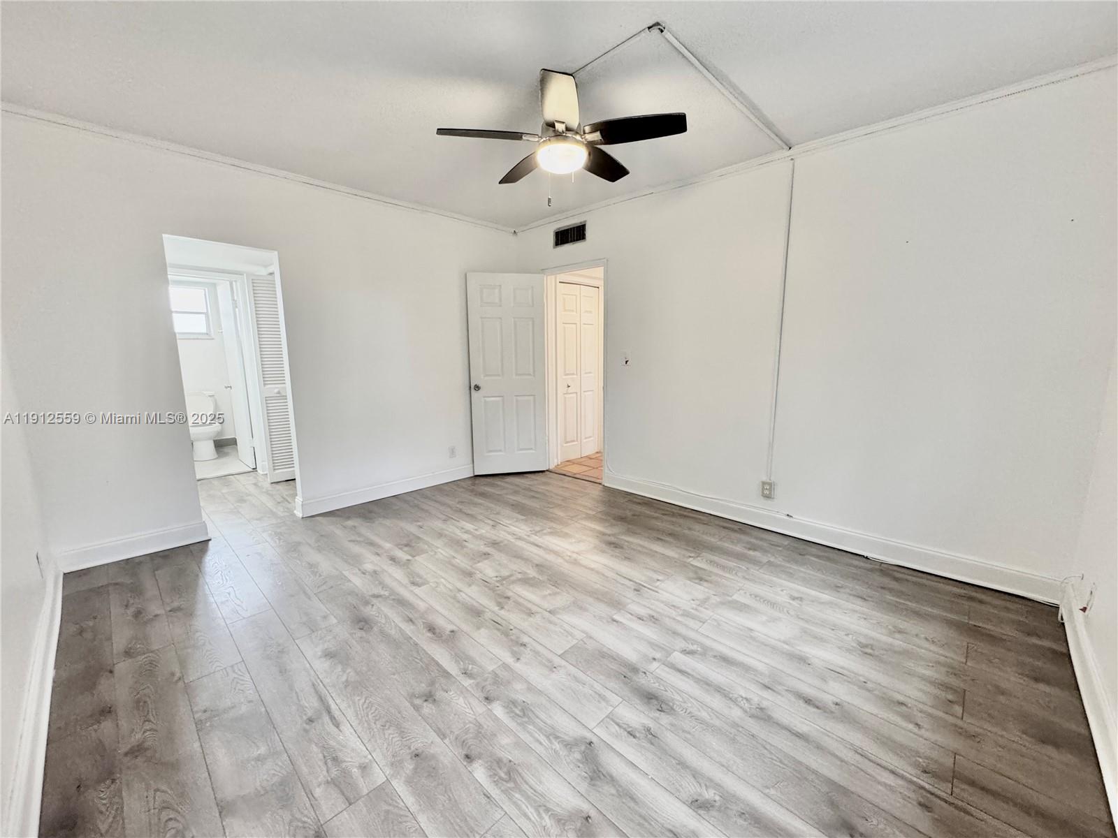 14901 Southwest 4th Street, Unit 5A Pembroke Pines, FL 33027 - Photo 10 of 21 a view of empty room with wooden floor