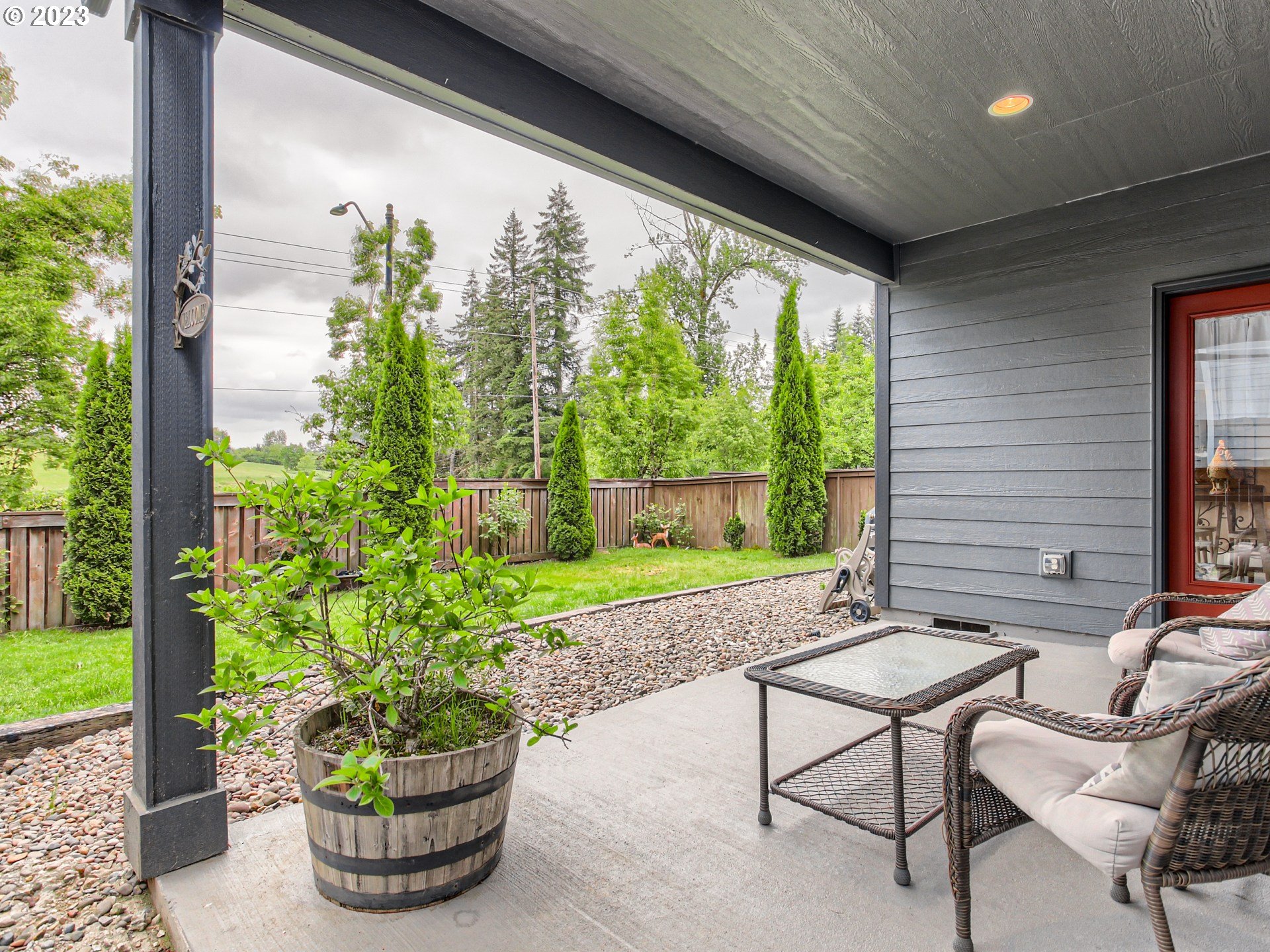 4404 North 4th Circle Ridgefield, WA 98642 - Photo 26 of 29 a view of a porch with furniture and garden