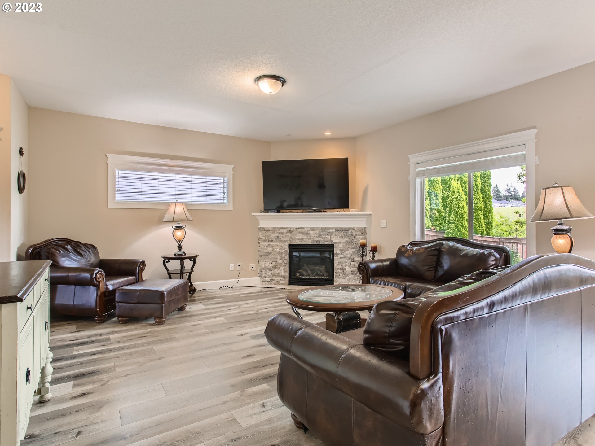 4404 North 4th Circle Ridgefield, WA 98642 - Photo 6 of 29 a living room with furniture a fireplace and a flat screen tv