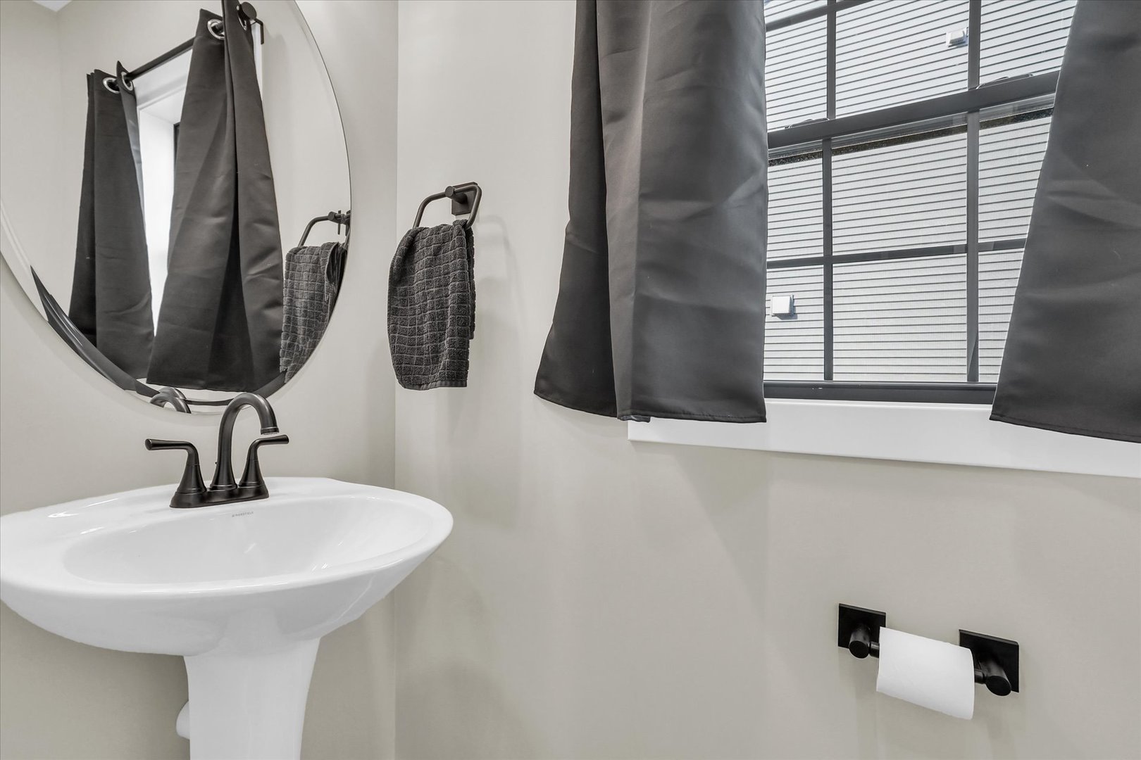 409 Sutton Street Savoy, IL 61874 - Photo 19 of 40 a bathroom with a sink and a mirror