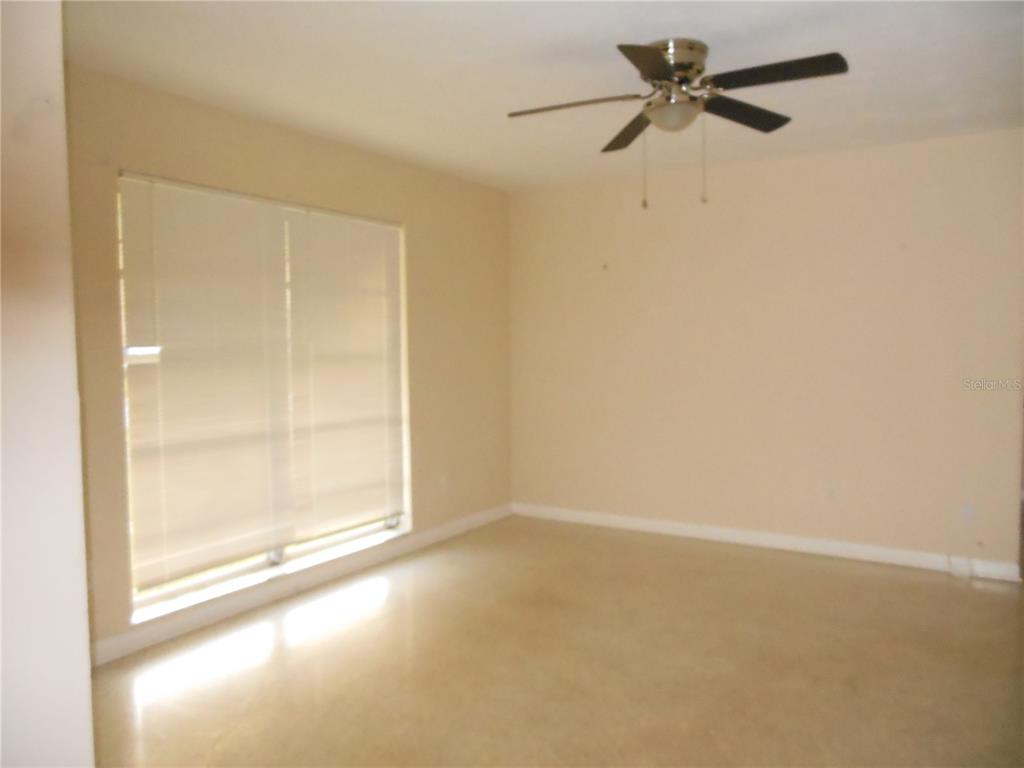 975 Shorecrest Avenue Deltona, FL 32725 - Photo 2 of 11 a view of empty room