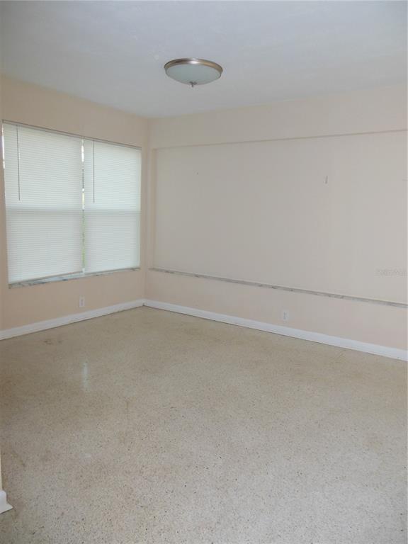975 Shorecrest Avenue Deltona, FL 32725 - Photo 5 of 11 a view of an empty room with a window