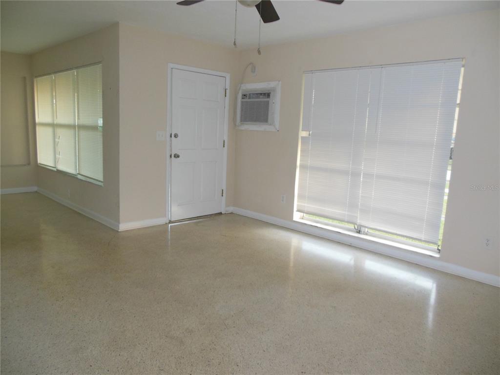 975 Shorecrest Avenue Deltona, FL 32725 - Photo 6 of 11 an empty room with windows and closet