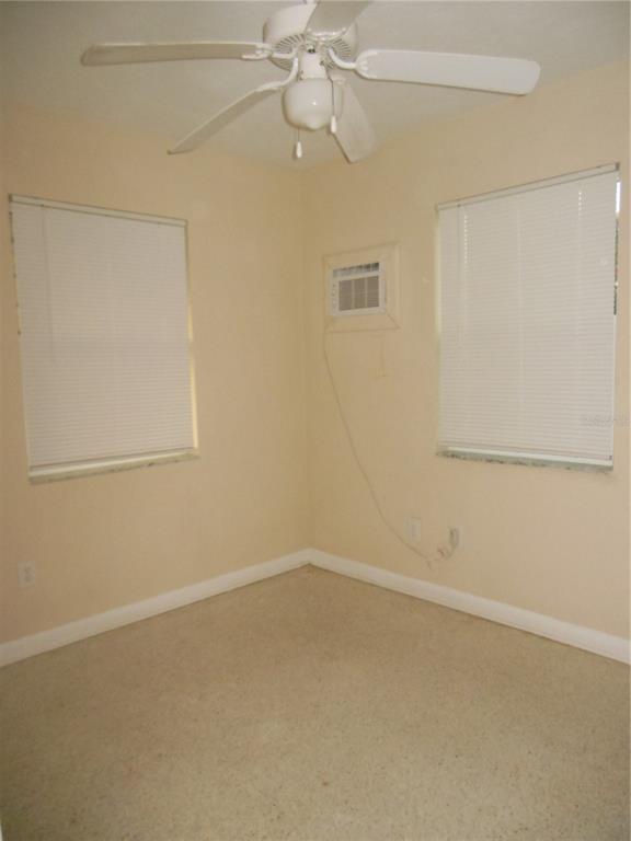 975 Shorecrest Avenue Deltona, FL 32725 - Photo 10 of 11 an empty room with a window and a fan