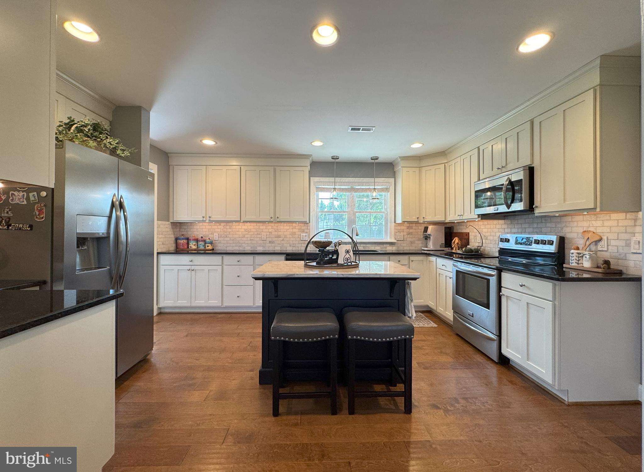 61 Rose Apple Road Levittown, PA 19056 - Photo 11 of 33 a kitchen with granite countertop a refrigerator stove top oven and sink
