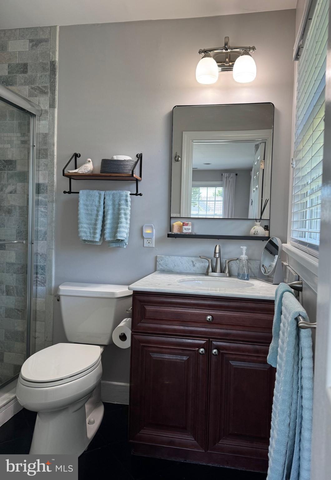 61 Rose Apple Road Levittown, PA 19056 - Photo 16 of 33 a bathroom with a toilet sink and mirror