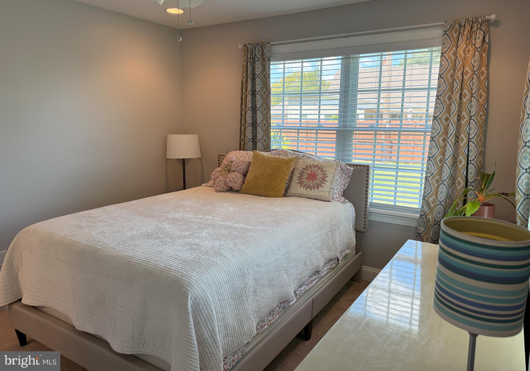 61 Rose Apple Road Levittown, PA 19056 - Photo 19 of 33 a bedroom with a bed and a window