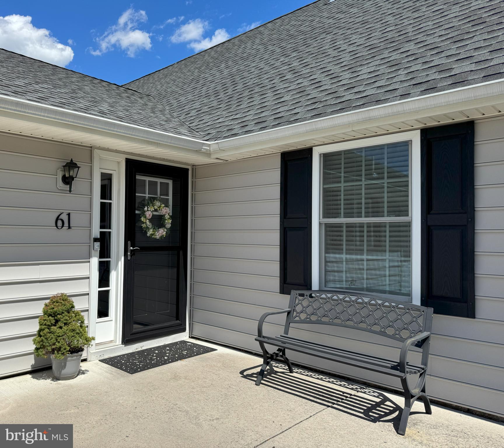 61 Rose Apple Road Levittown, PA 19056 - Photo 2 of 33 a bench in front of house