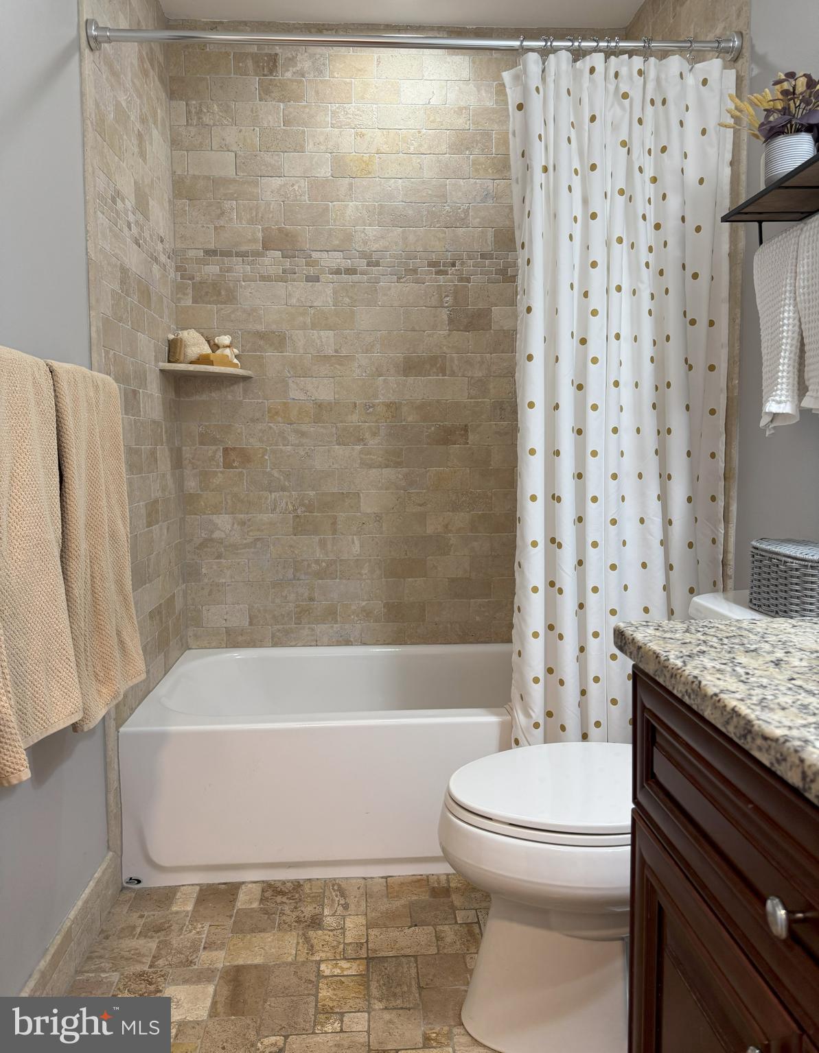 61 Rose Apple Road Levittown, PA 19056 - Photo 21 of 33 a bathroom with a granite countertop bathtub shower sink vanity and toilet