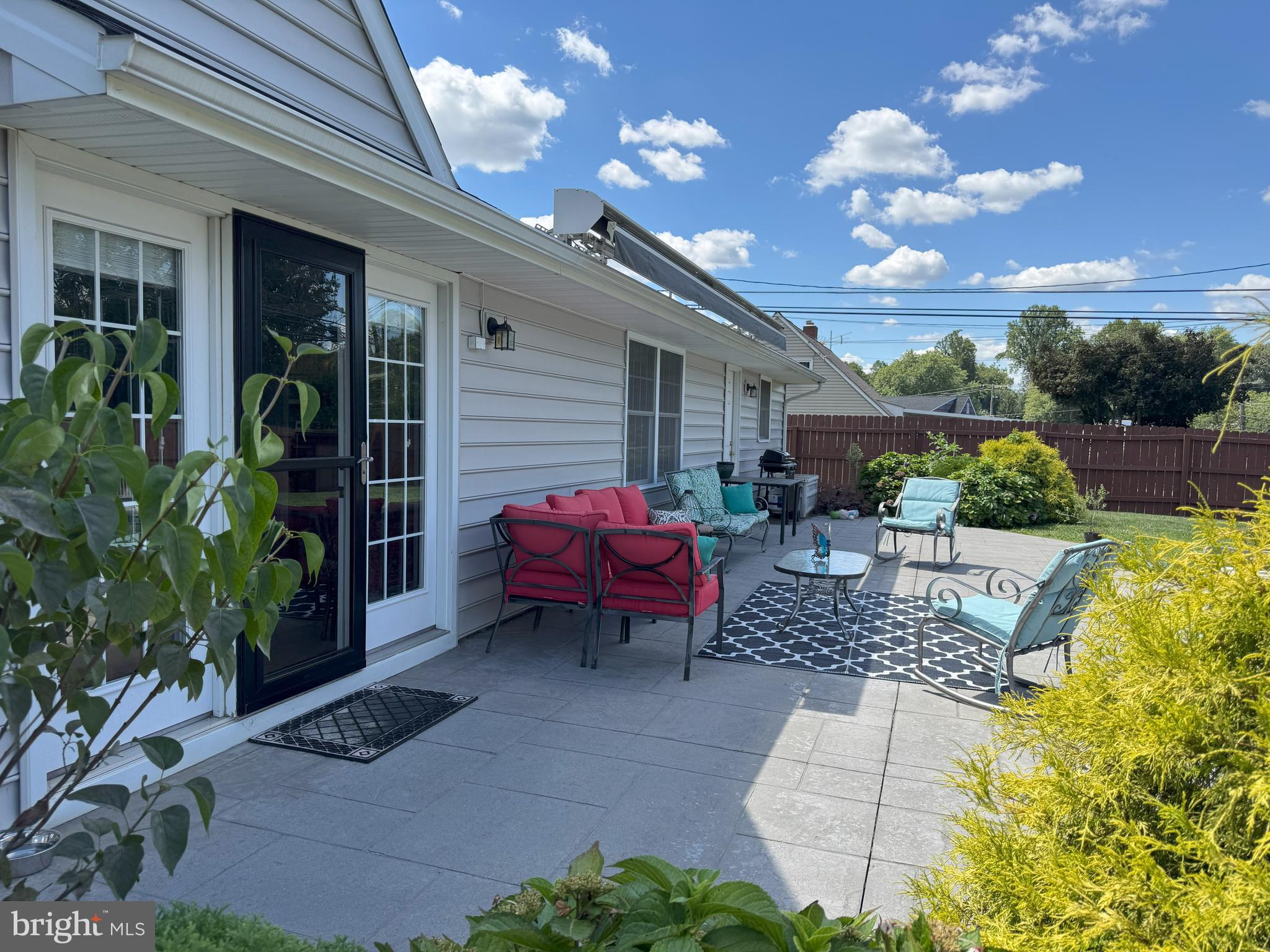61 Rose Apple Road Levittown, PA 19056 - Photo 30 of 33 a view of a patio with couches table and chairs and potted plants