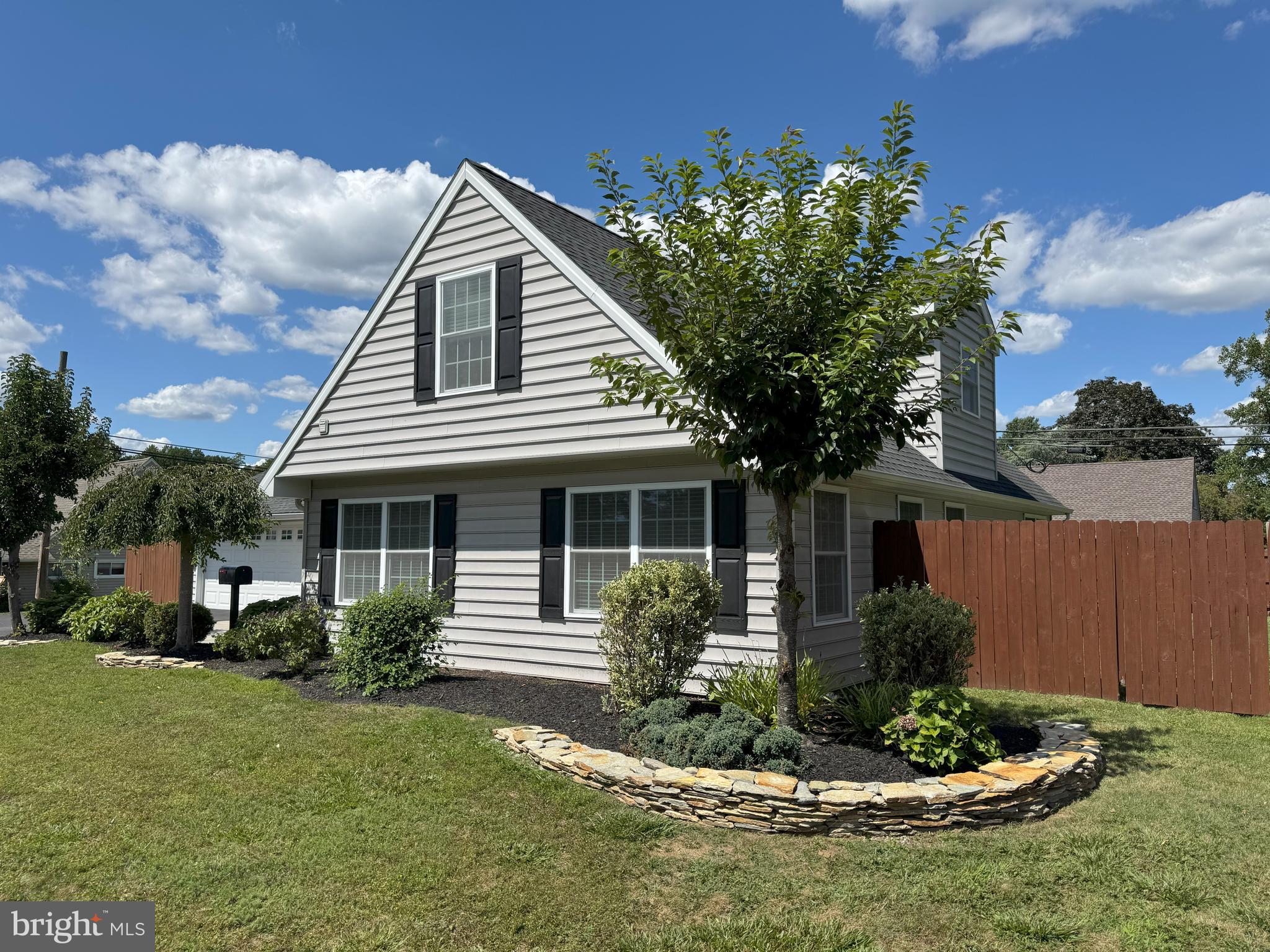 61 Rose Apple Road Levittown, PA 19056 - Photo 33 of 33 a front view of a house with a garden