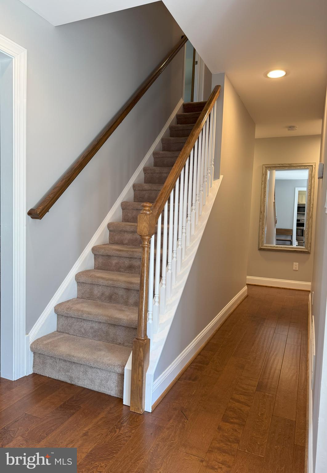 61 Rose Apple Road Levittown, PA 19056 - Photo 5 of 33 a view of staircase with wooden floor and a rug
