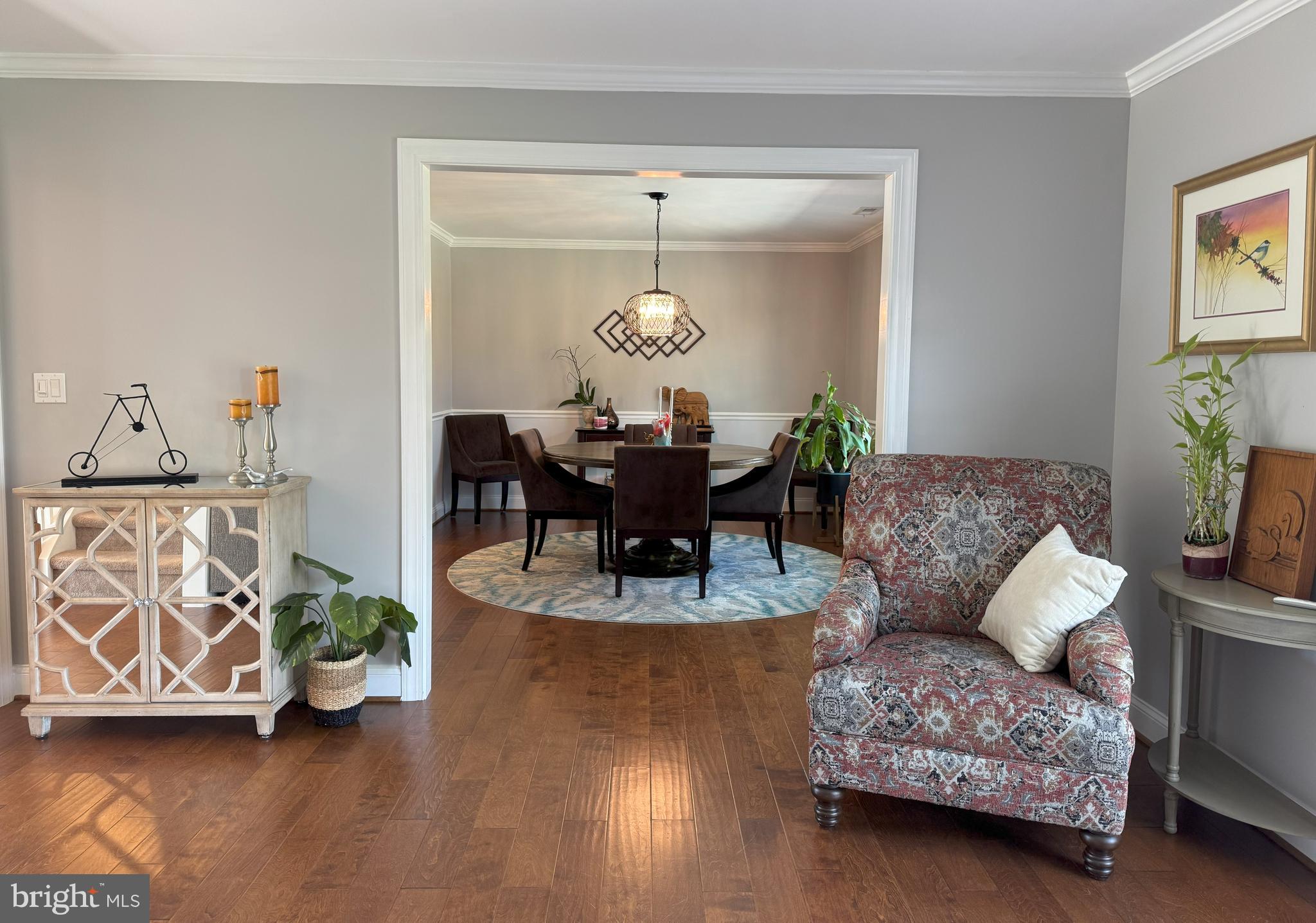 61 Rose Apple Road Levittown, PA 19056 - Photo 7 of 33 a living room with furniture and a chandelier