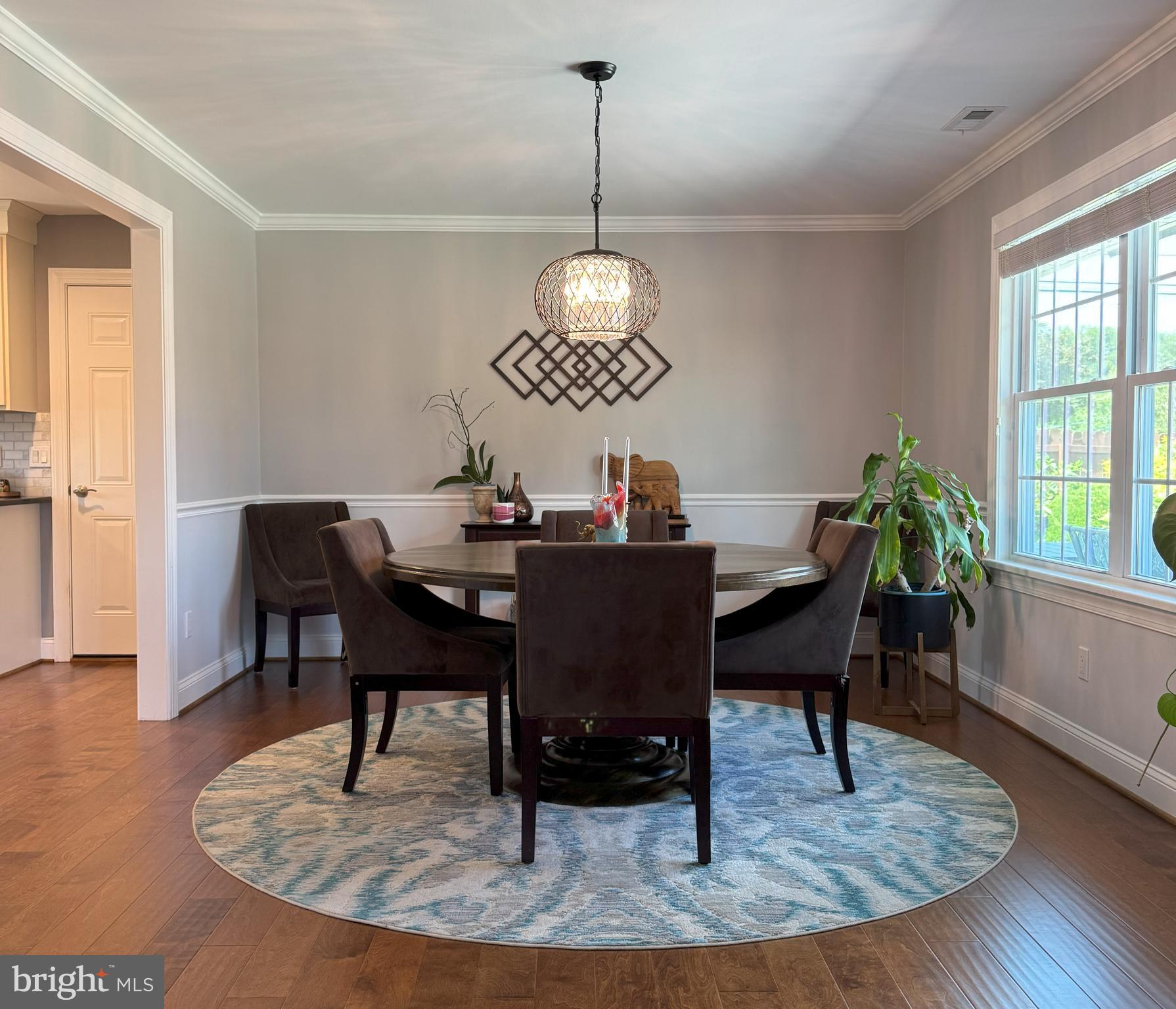 61 Rose Apple Road Levittown, PA 19056 - Photo 8 of 33 a view of a dining room with furniture window and wooden floor