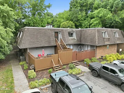 an aerial view of a house with lots of trees