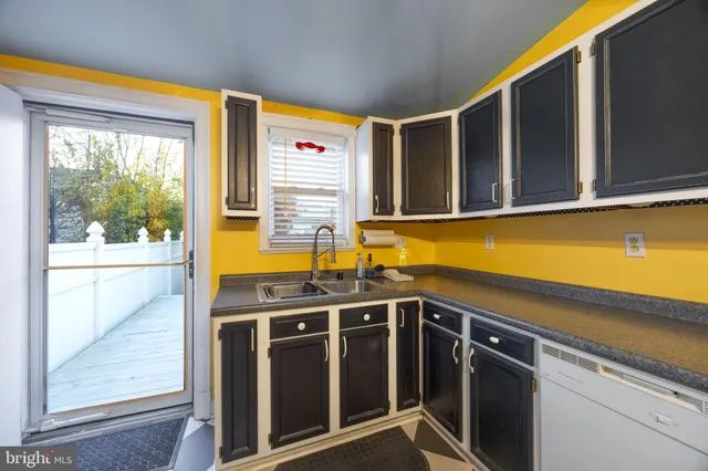 a kitchen with stainless steel appliances granite countertop a sink and a cabinets